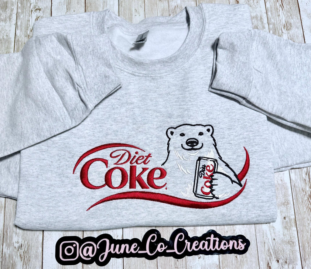 I need a Diet Coke polar bear embroidered cozy sweatshirt comes with a mini sized Diet Coke on the sleeve.