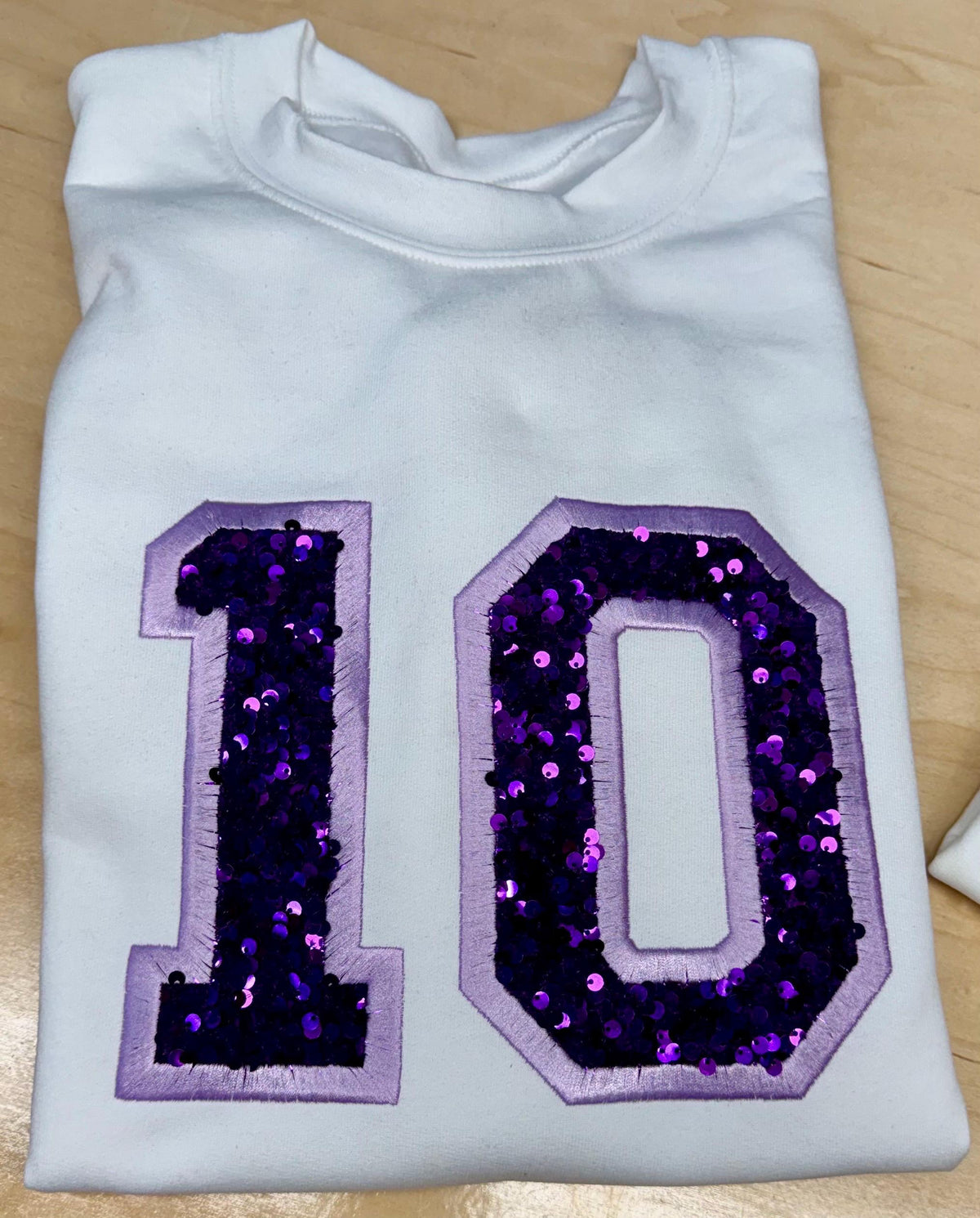 Sport team number sequin embroidered sweatshirt.