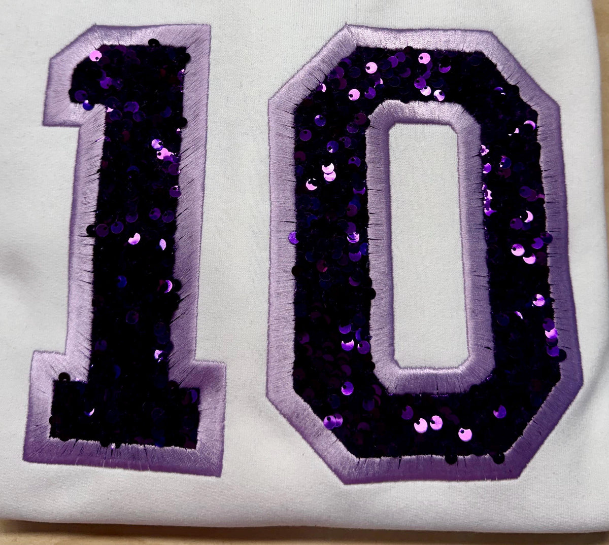 Sport team number sequin embroidered sweatshirt.