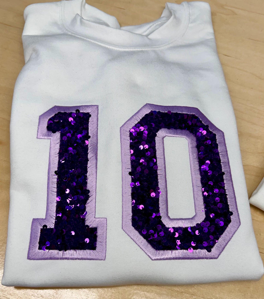 Sport team number sequin embroidered sweatshirt.
