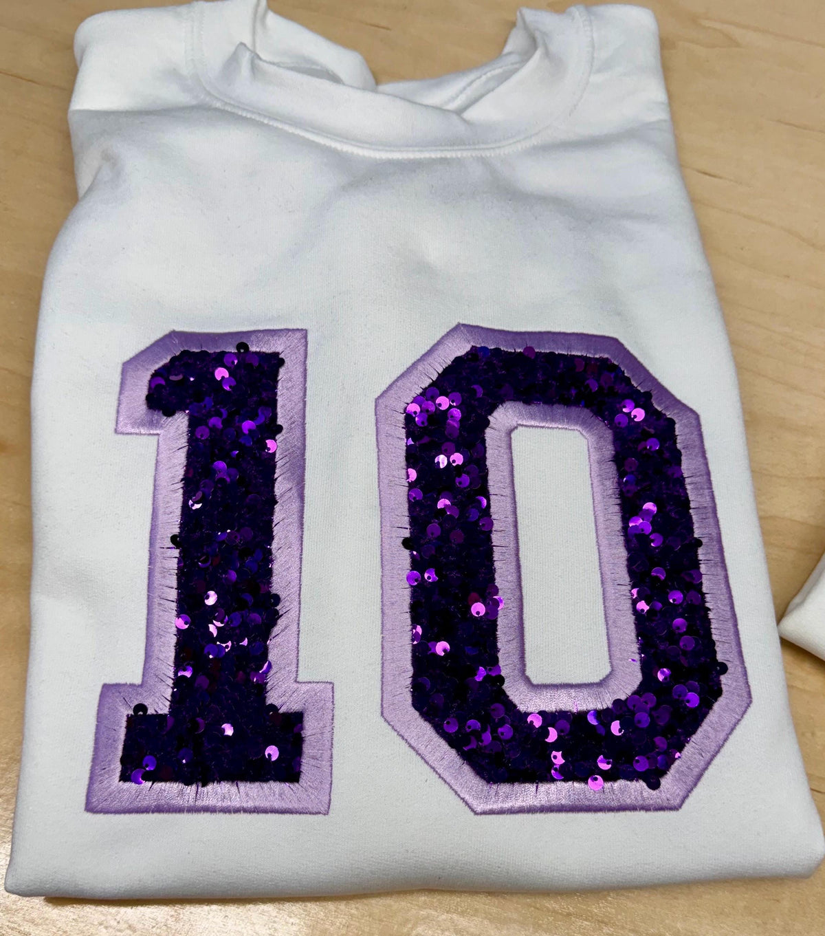 Sport team number sequin embroidered sweatshirt.