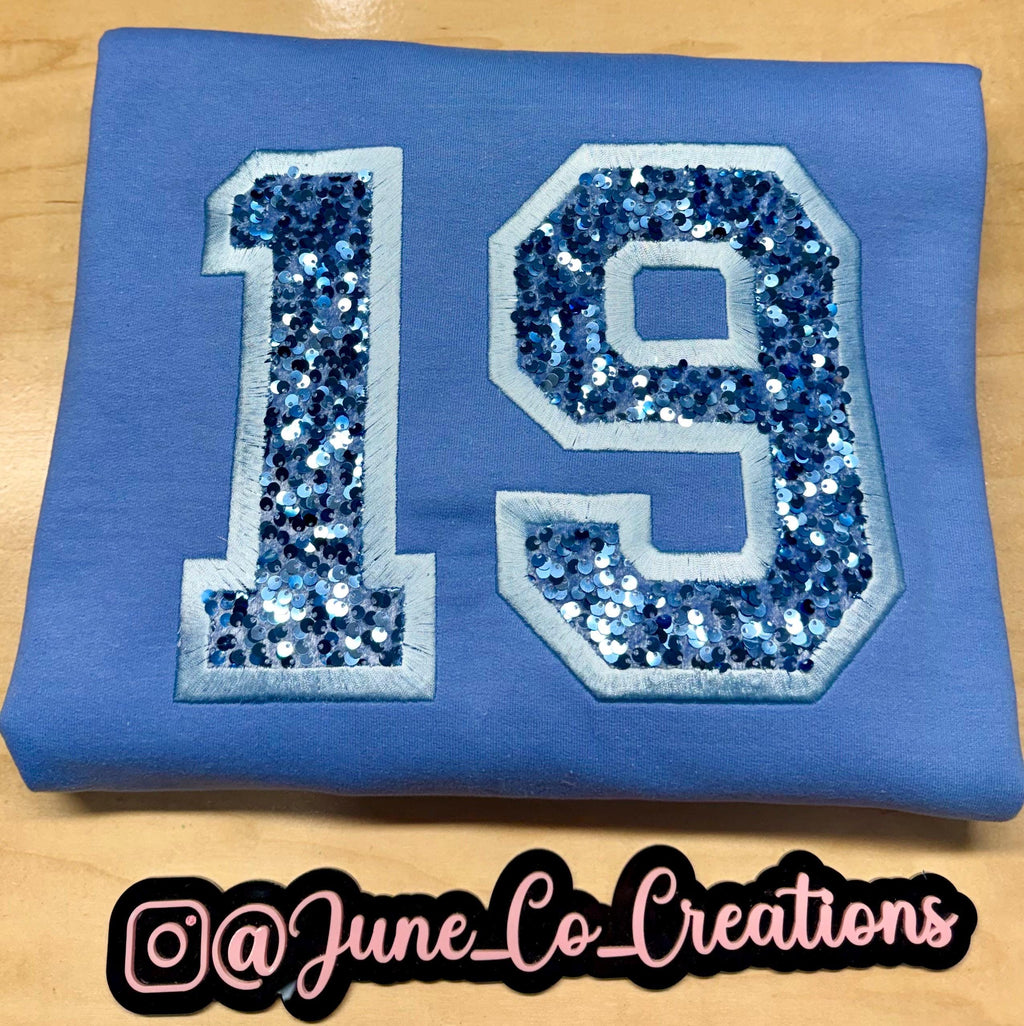 Sport team number sequin embroidered sweatshirt.