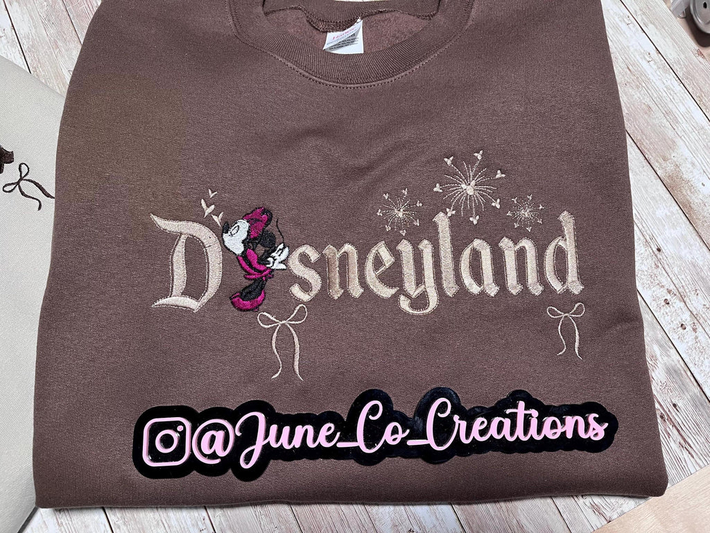 Disneyland Cozy embroidered Sweatshirt. Featuring Disney classic icons. All the things you love Disney.