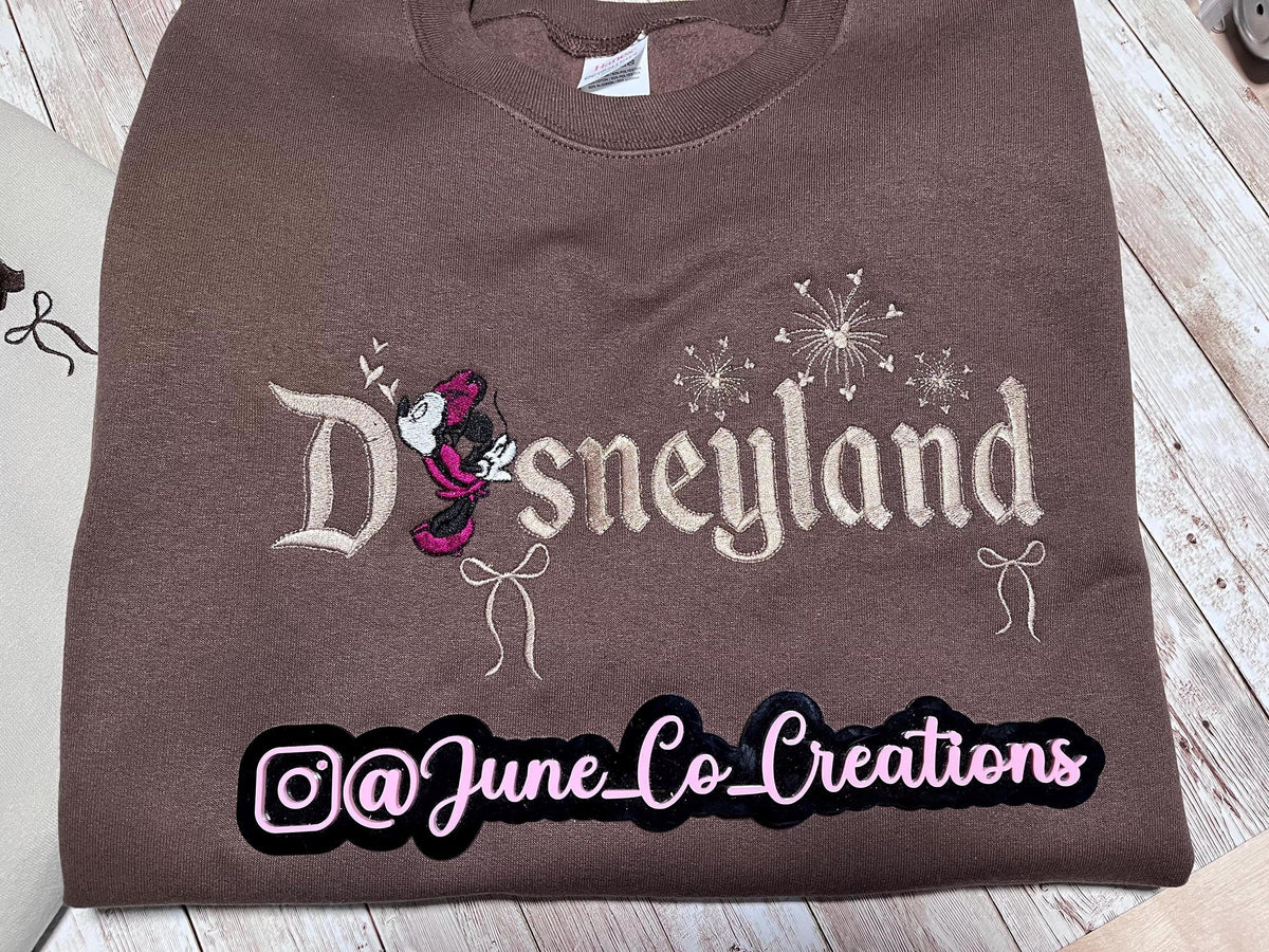 Disneyland Cozy embroidered Sweatshirt. Featuring Disney classic icons. All the things you love Disney.