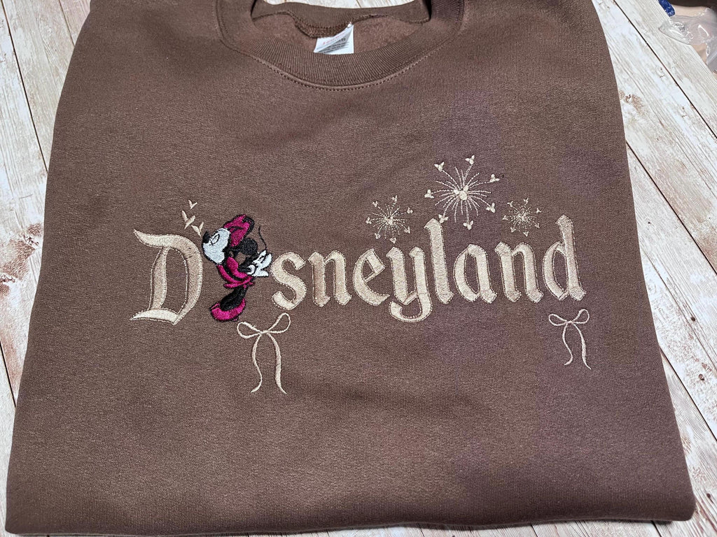 Disneyland Cozy embroidered Sweatshirt. Featuring Disney classic icons. All the things you love Disney.