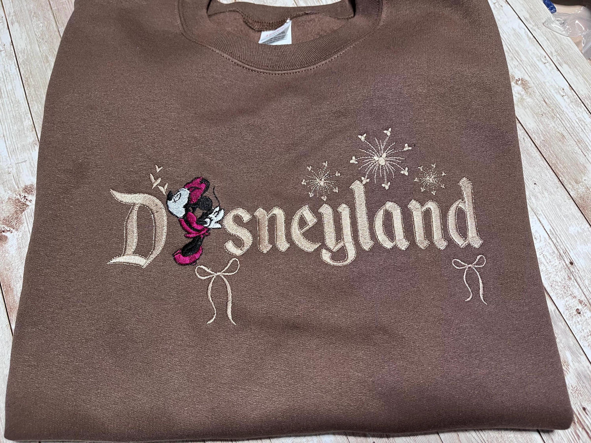 Disneyland Cozy embroidered Sweatshirt. Featuring Disney classic icons. All the things you love Disney.