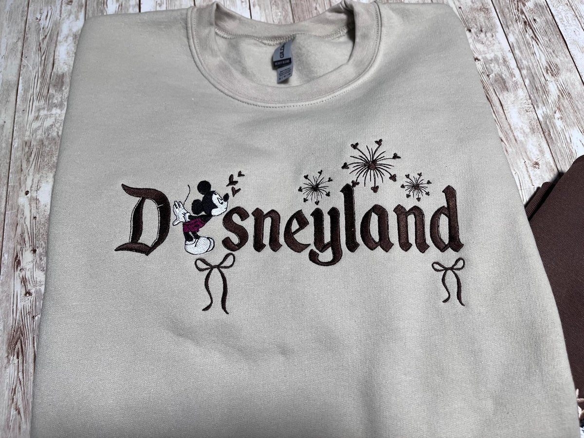 Disneyland Cozy embroidered Sweatshirt. Featuring Disney classic icons. All the things you love Disney.