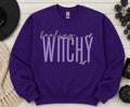 Celebrate the season with our cozy embroidered sweatshirt featuring “Feeling Witchy” embellished with some bats