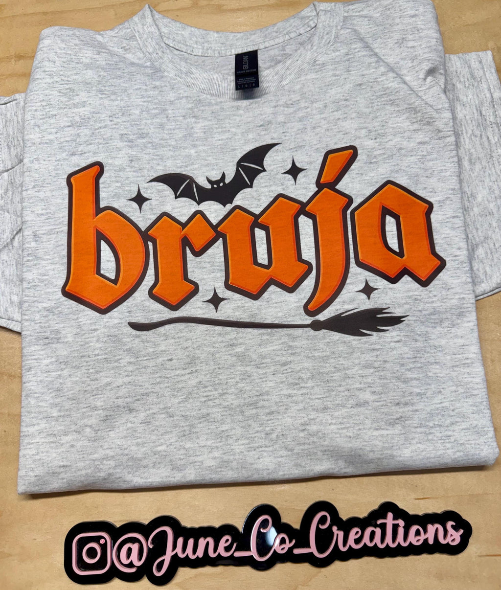 Bruja “Witch” spooky season tshirt. Broom and Bats this made to order tshirt is perfect for fall.