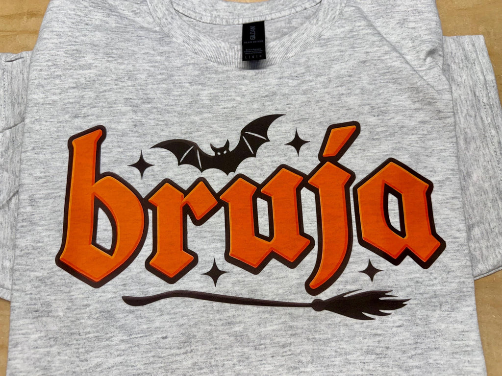 Bruja “Witch” spooky season tshirt. Broom and Bats this made to order tshirt is perfect for fall.