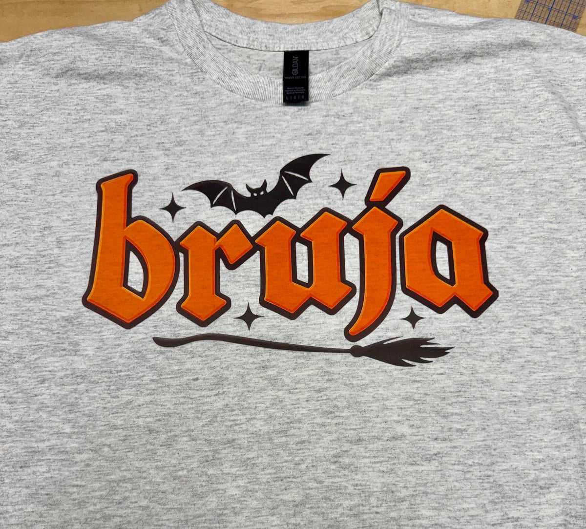 Bruja “Witch” spooky season tshirt. Broom and Bats this made to order tshirt is perfect for fall.